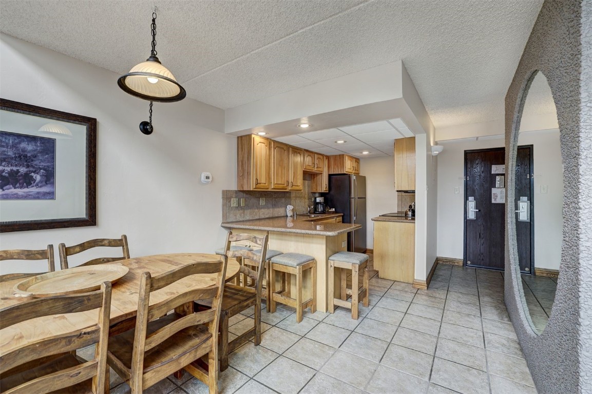 601 Village Road, Unit 503 Breckenridge, CO 80424 - Photo 10 of 48 a view of kitchen with breakfast area
