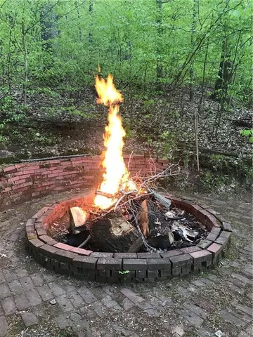 a view of a backyard with wooden fence