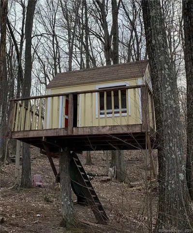 a house that has tree in front of it