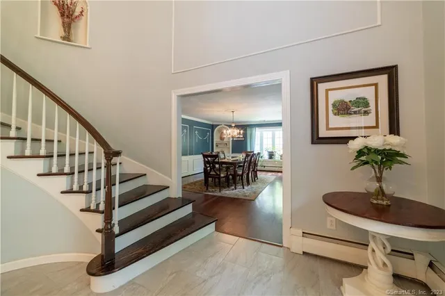 a view of a livingroom with furniture and a potted plant