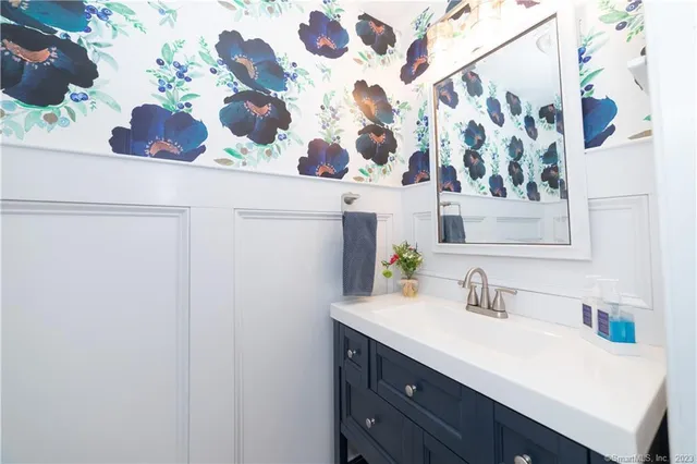 a bathroom with a sink and a mirror