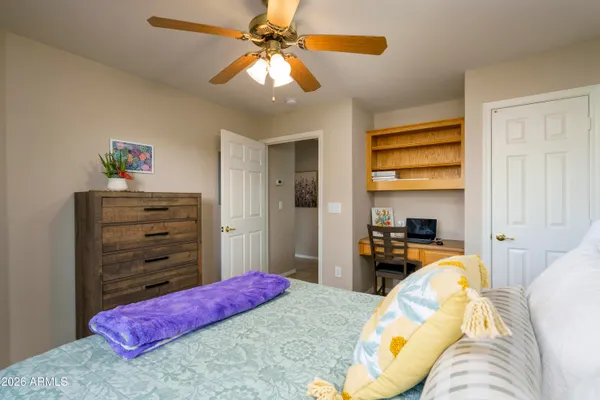 a bedroom with a bed and furniture