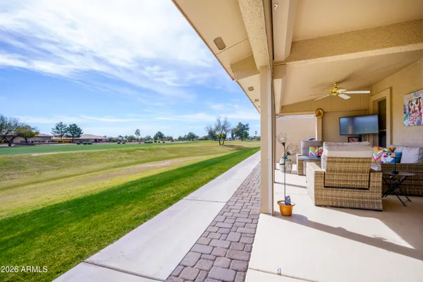 a view of a patio with a yard