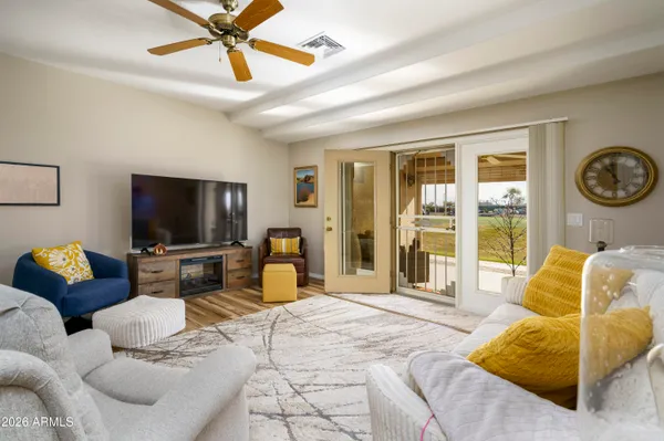 a living room with furniture and a flat screen tv