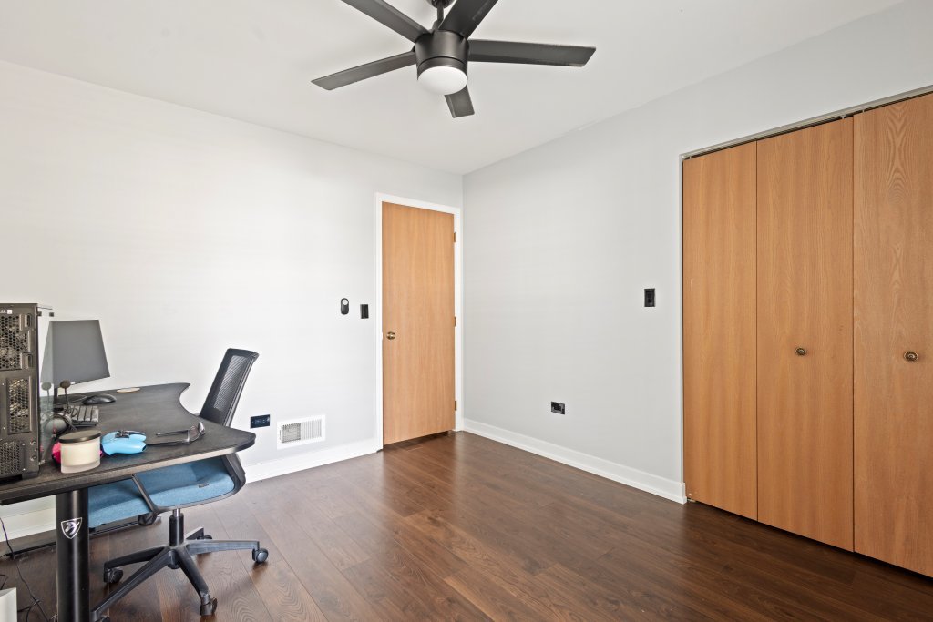 798 Burning Trail Carol Stream, IL 60188 - Photo 12 of 40 a view of a workspace with wooden floor and a window
