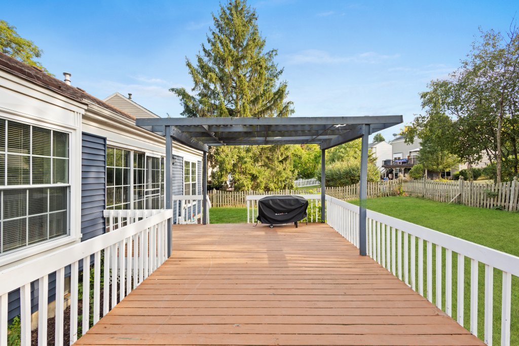 798 Burning Trail Carol Stream, IL 60188 - Photo 27 of 40 a view of a roof deck with wooden floor and fence