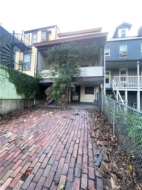 323 Hancock Street Pittsburgh, PA 15219 - Photo 34 of 41 a view of a brick house with many windows