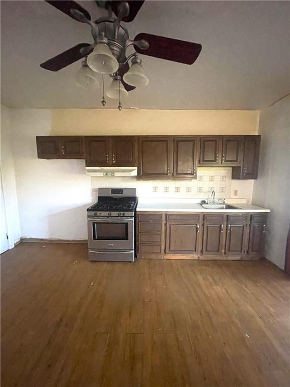323 Hancock Street Pittsburgh, PA 15219 - Photo 7 of 41 a kitchen with kitchen island a sink stainless steel appliances and cabinets