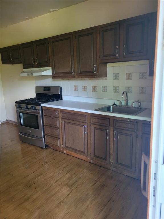 323 Hancock Street Pittsburgh, PA 15219 - Photo 8 of 41 a kitchen with a sink and cabinets