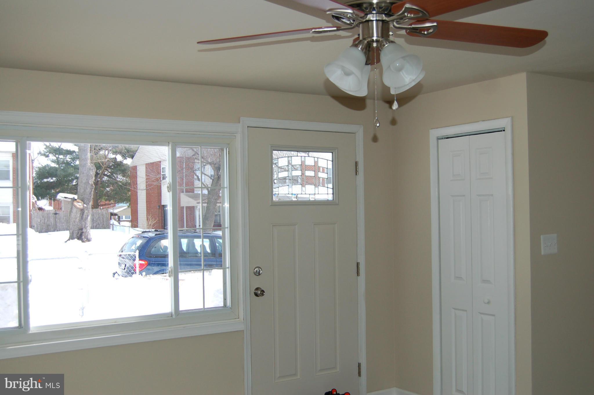 2016 Kelmore Road Baltimore, MD 21222 - Photo 6 of 27 Living Room-Front Door, Window, Ceiling Fan