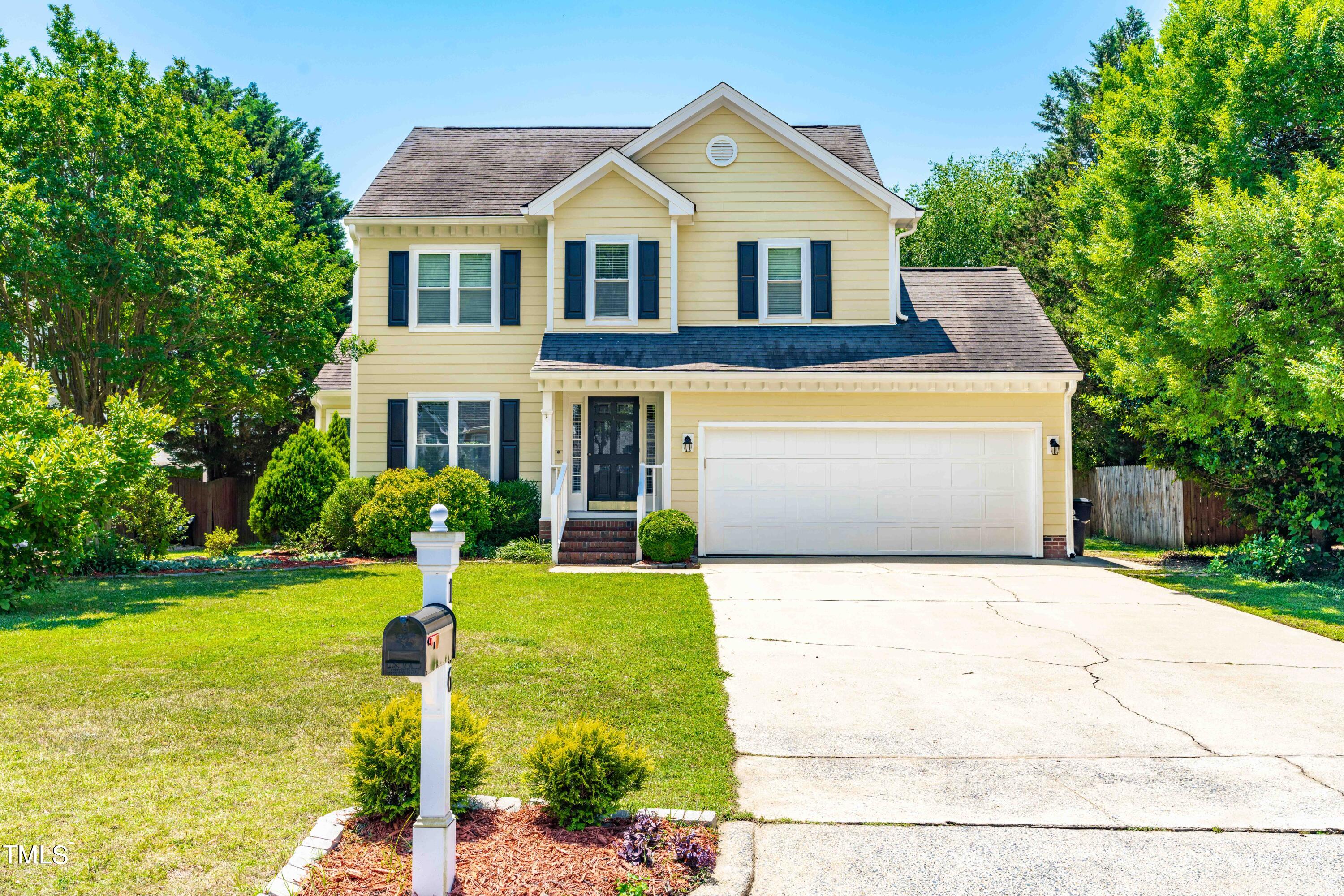 1206 Rainesview Lane Apex, NC 27502 - Photo 1 of 26 a front view of house with yard and trees