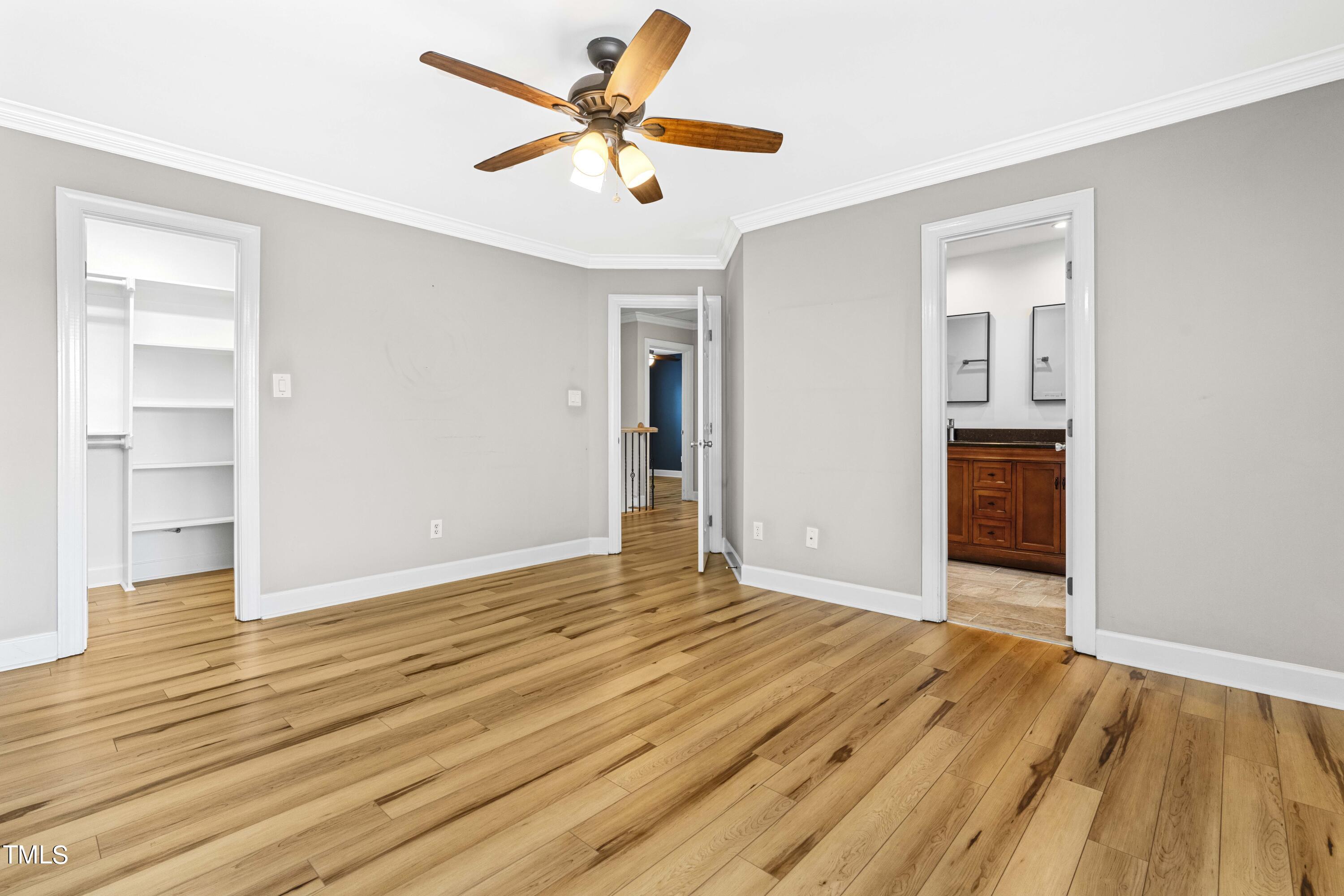 1206 Rainesview Lane Apex, NC 27502 - Photo 13 of 26 a view of an empty room with wooden floor