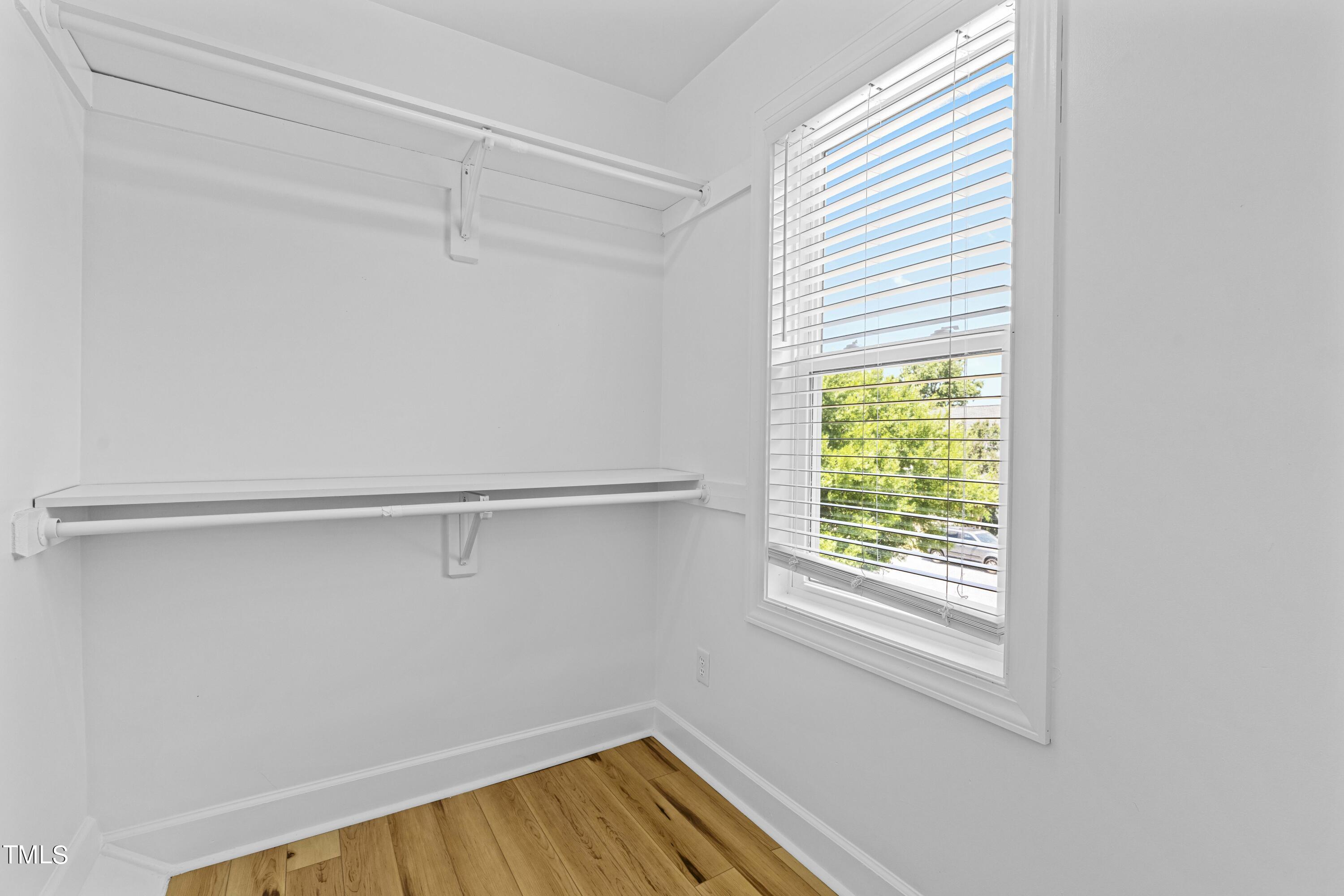 1206 Rainesview Lane Apex, NC 27502 - Photo 20 of 26 a view of a room with racks on the wall