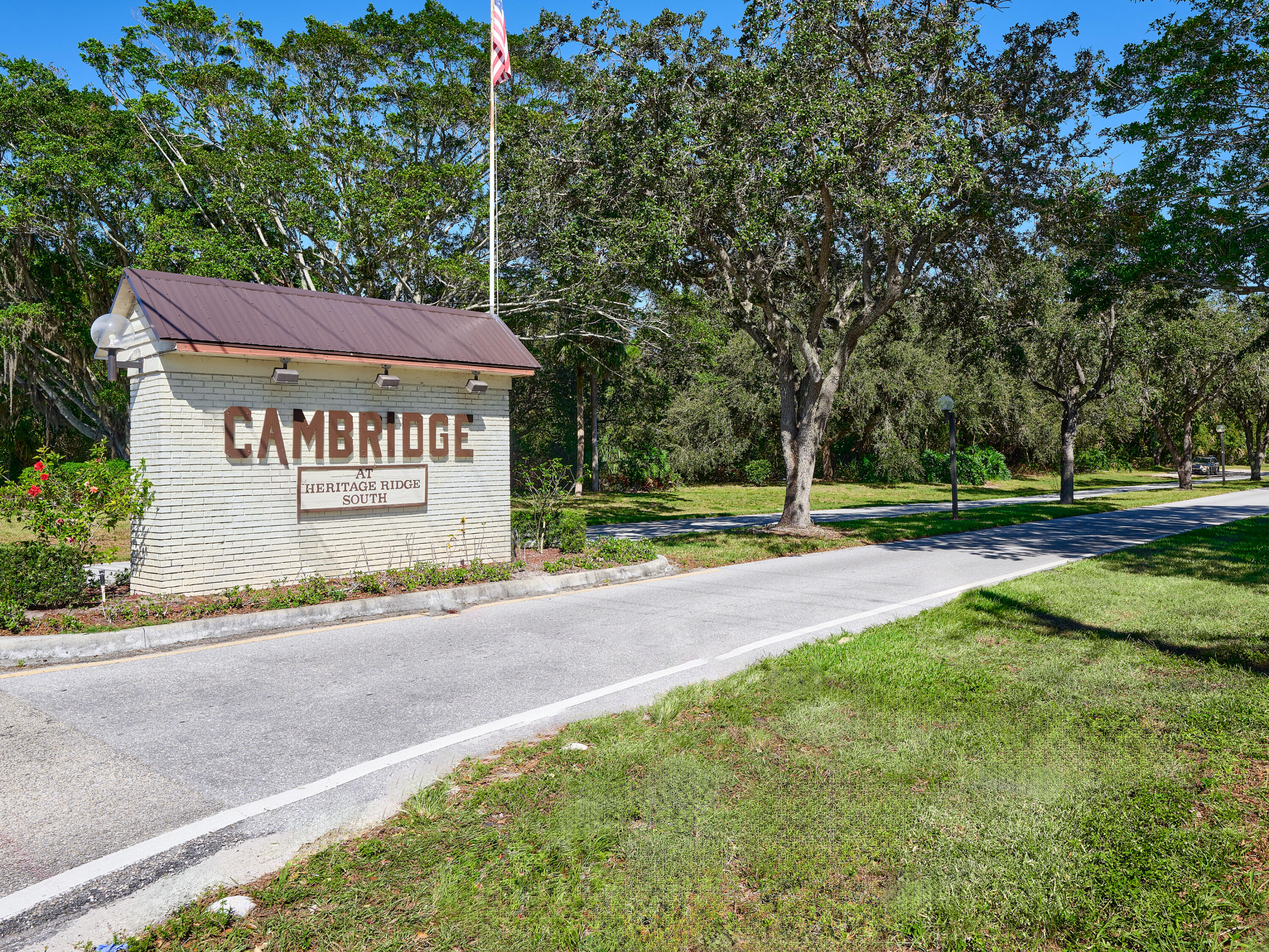 6977 Southeast Delegate Street Hobe Sound, FL 33455 - Photo 49 of 60 a sign on the side of a building