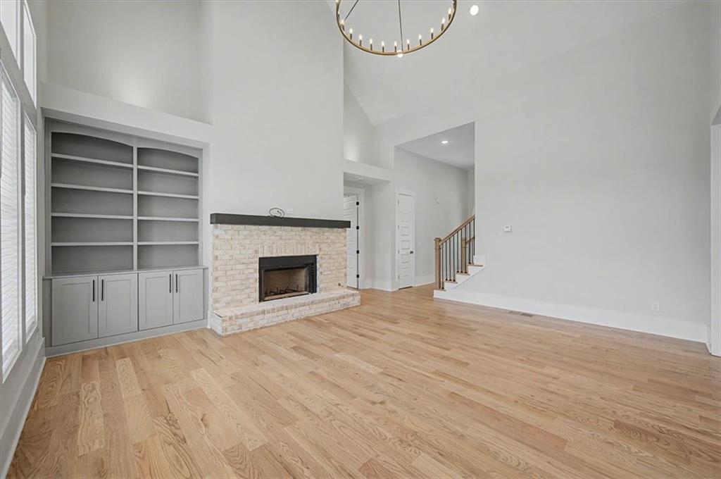 217 Laura Lake Road Marietta, GA 30066 - Photo 12 of 54 a view of an empty room with a fireplace and a window