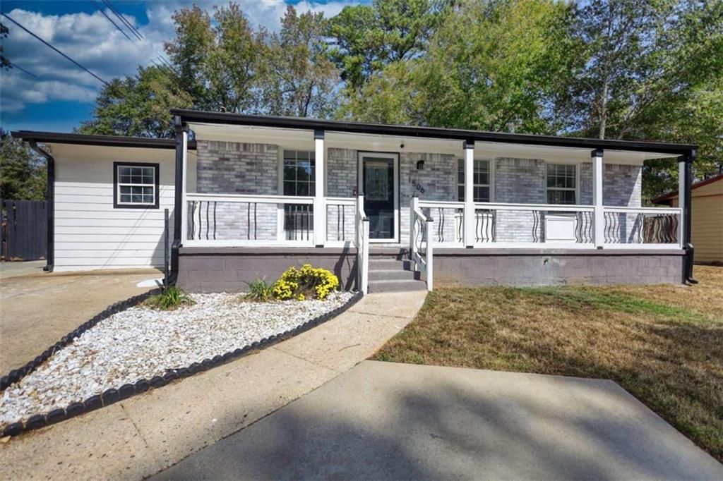 front view of a house with a yard