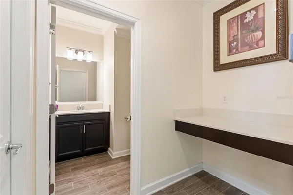 a room with a sink and a mirror