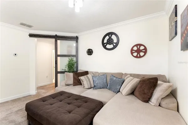 a living room with furniture and a window