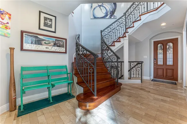 a kitchen with stainless steel appliances granite countertop a refrigerator stove microwave and sink