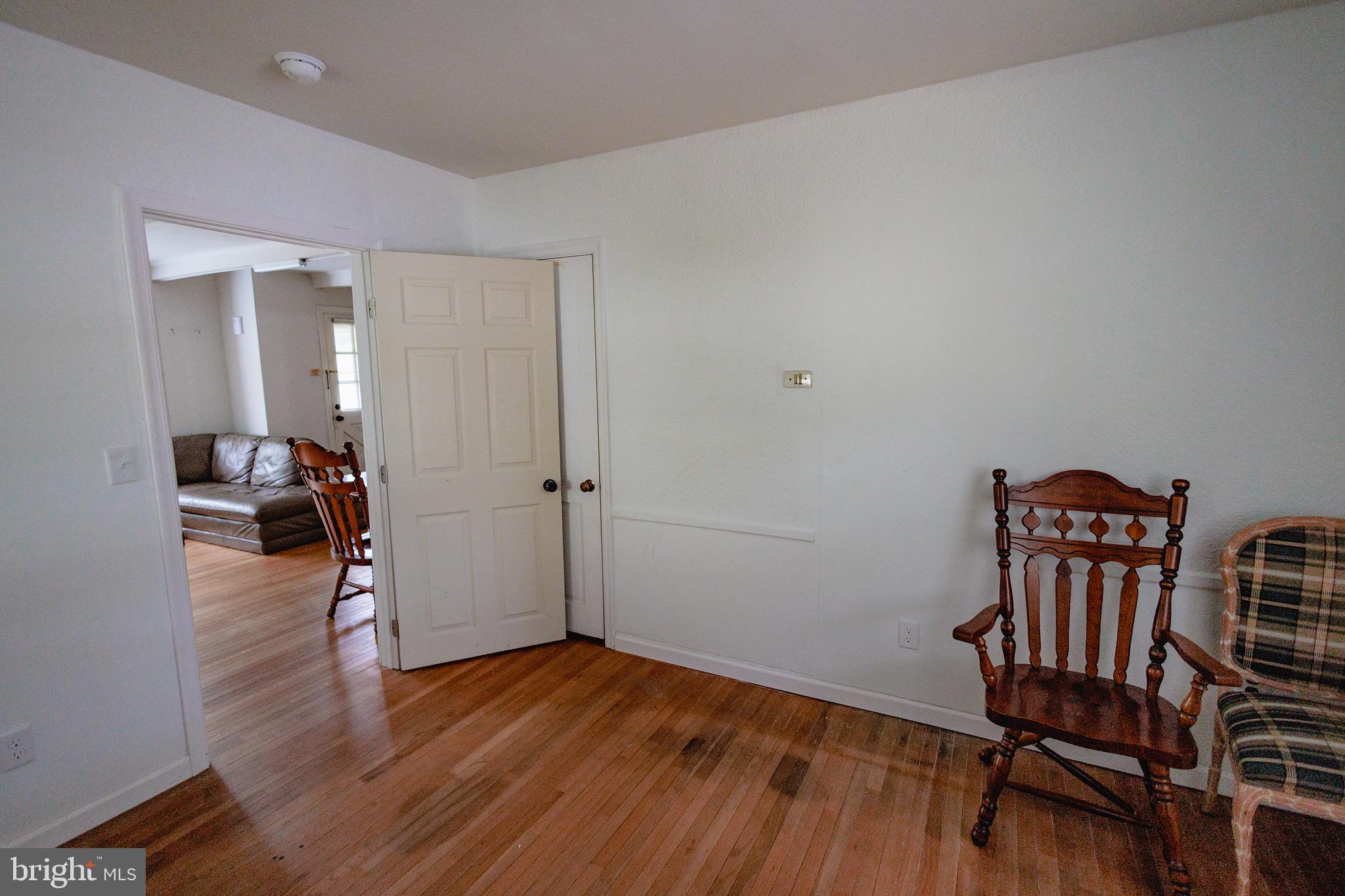 321 Villanova Road Glassboro, NJ 08028 - Photo 11 of 29 a view of a room with wooden floor furniture and a bedroom