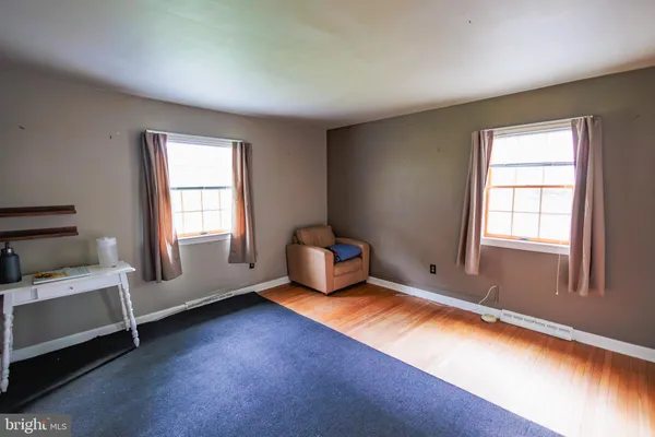 a living room with furniture and windows