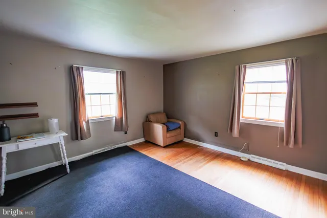 a living room with furniture and windows