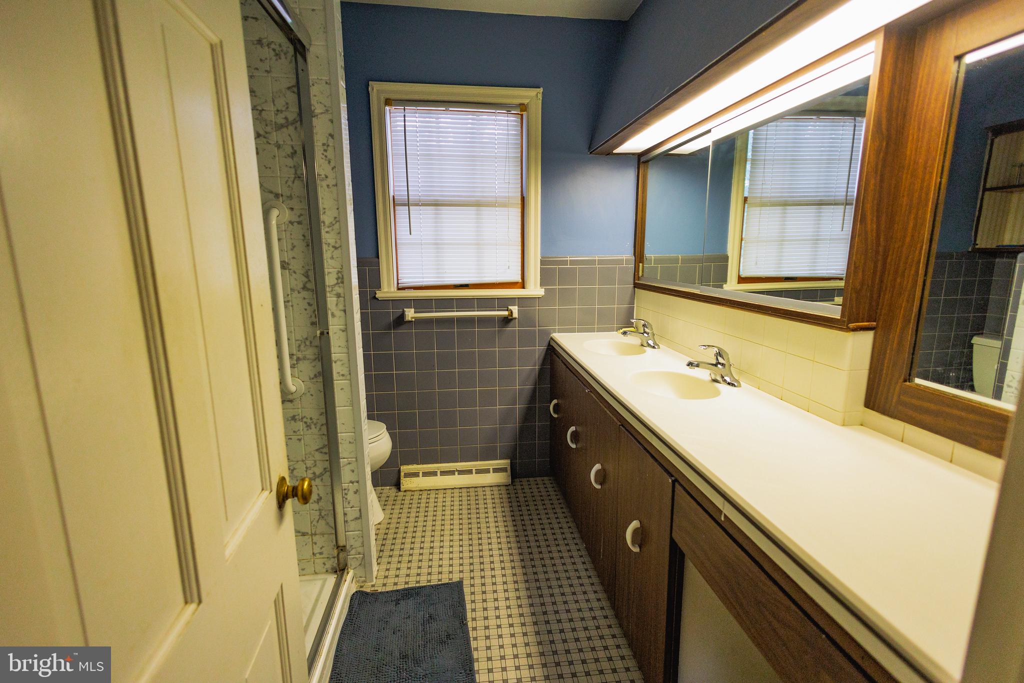 321 Villanova Road Glassboro, NJ 08028 - Photo 23 of 29 a bathroom with a sink and a shower