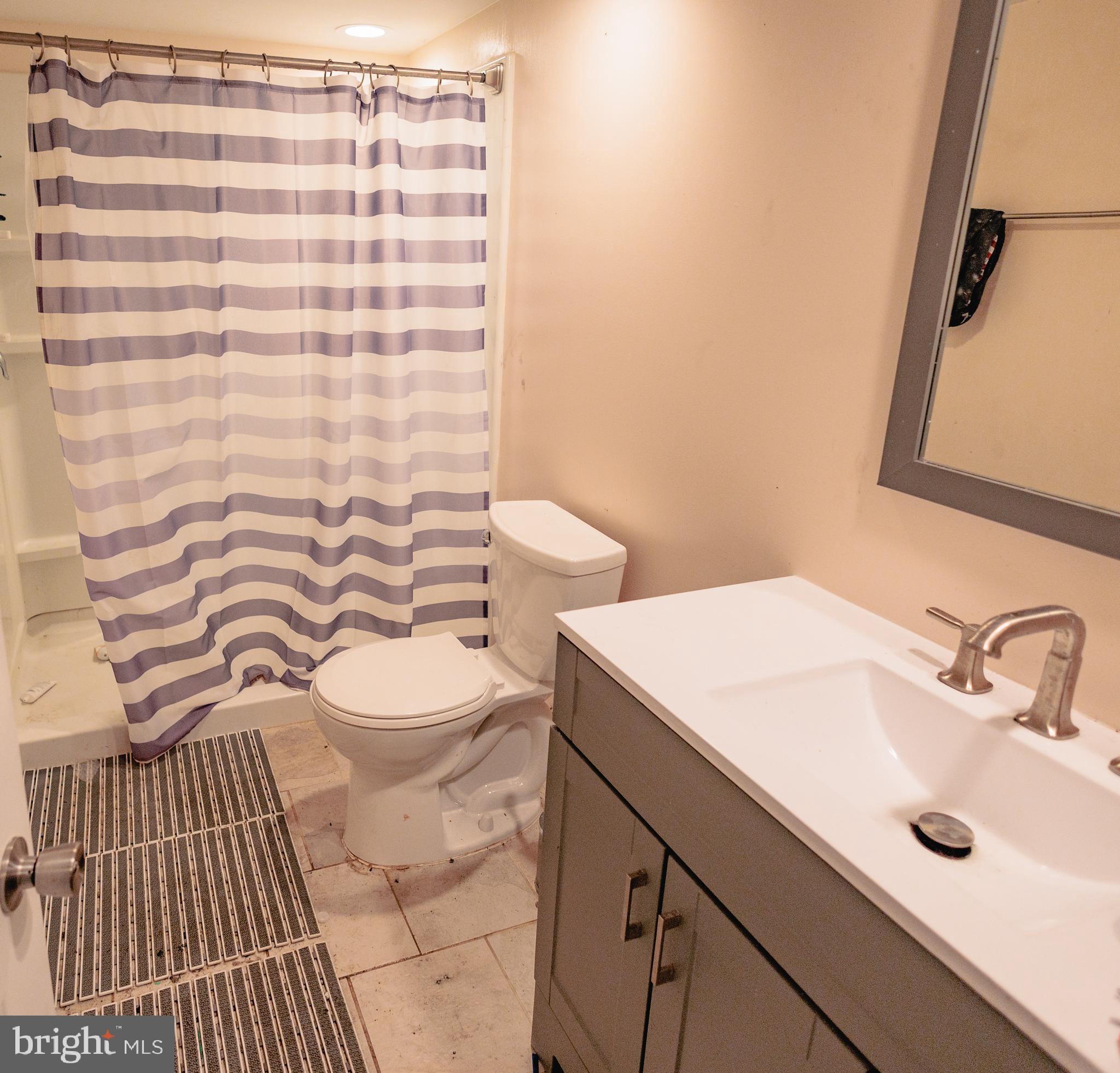 321 Villanova Road Glassboro, NJ 08028 - Photo 25 of 29 a bathroom with a sink and a mirror