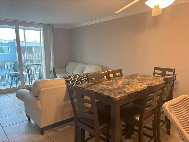 a dining table with chairs and window