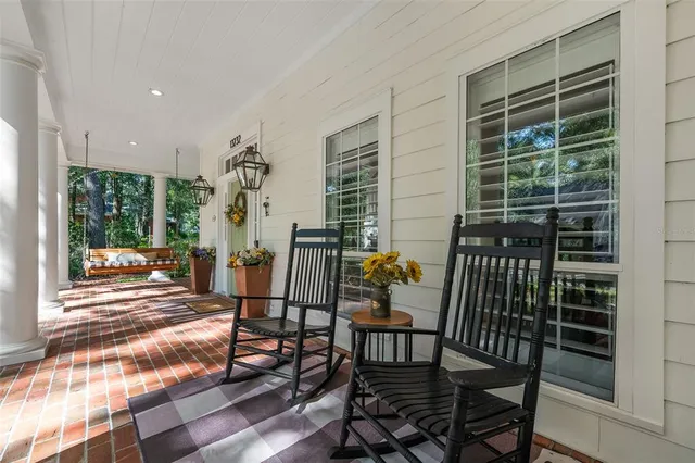 a view of a dining room and hall with wooden floor