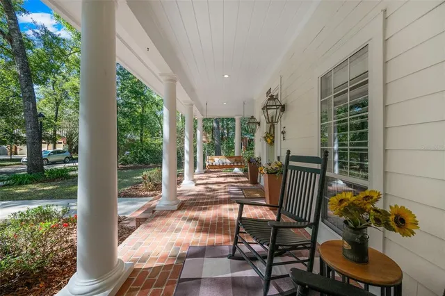 a view of balcony with furniture