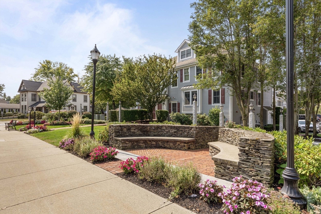 756 Washington Street, Unit A Canton, MA 02021 - Photo 17 of 20 a view of a house with a yard and garden