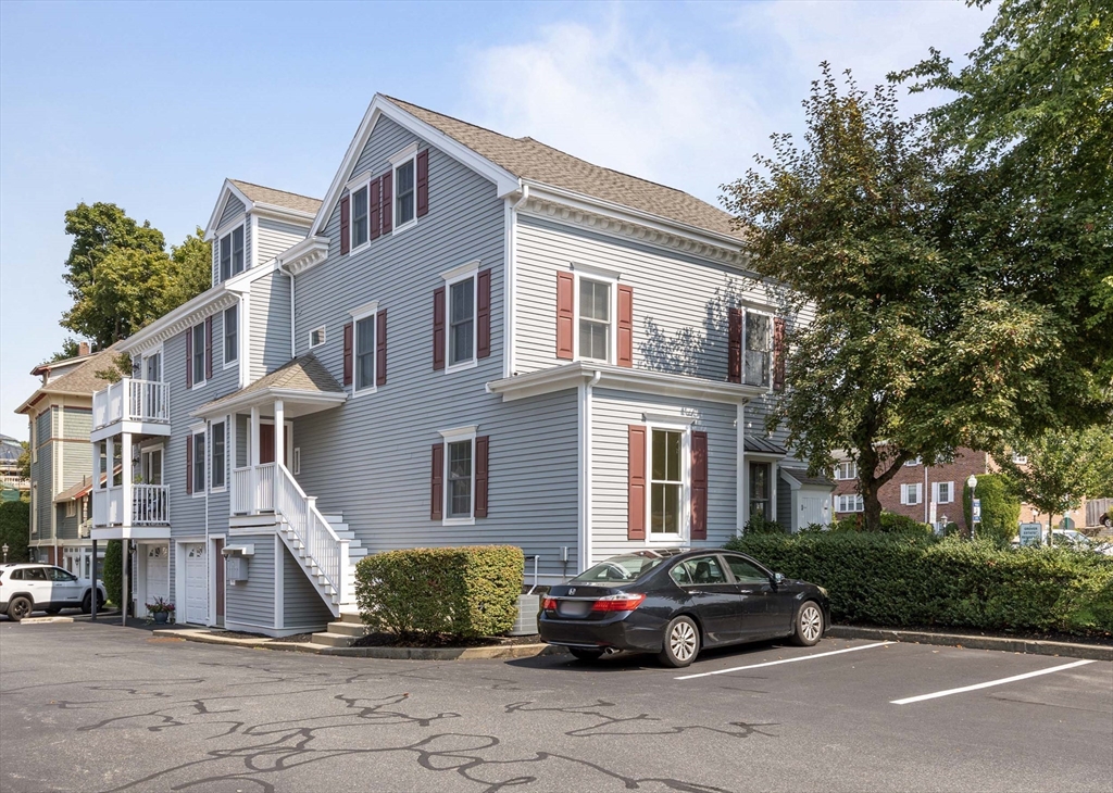 756 Washington Street, Unit A Canton, MA 02021 - Photo 18 of 20 a front view of a house with a garden