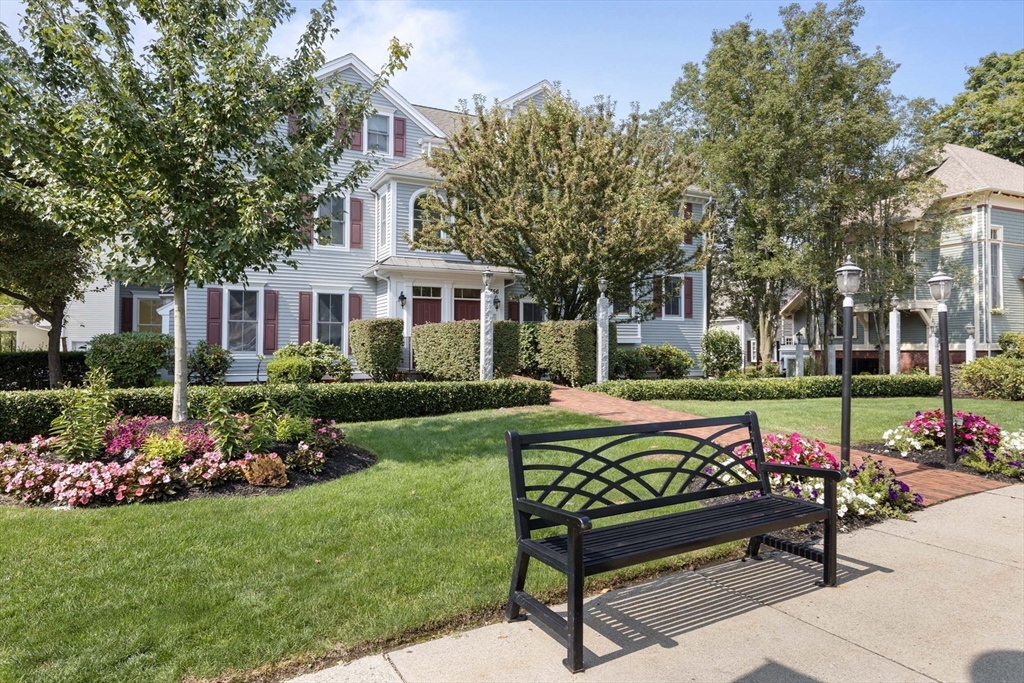 756 Washington Street, Unit A Canton, MA 02021 - Photo 20 of 20 a view of a bench in back yard of the house