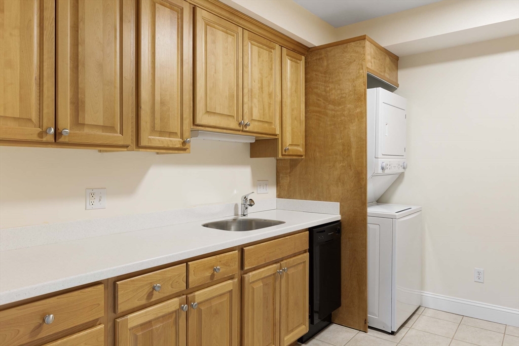 756 Washington Street, Unit A Canton, MA 02021 - Photo 7 of 20 a bathroom with a sink a mirror and a shower curtain