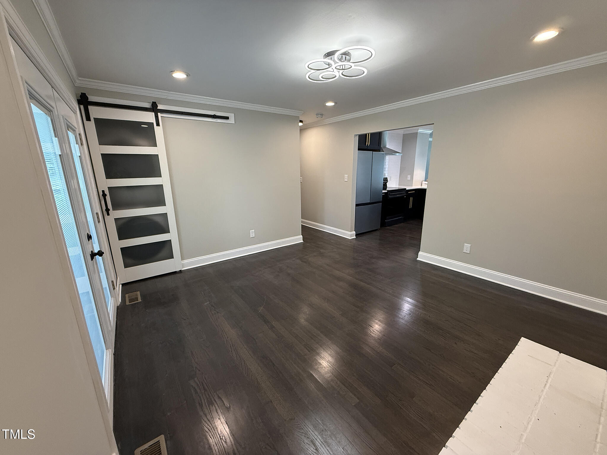215 Walnut Street Cary, NC 27511 - Photo 12 of 33 an empty room with wooden floor and closet