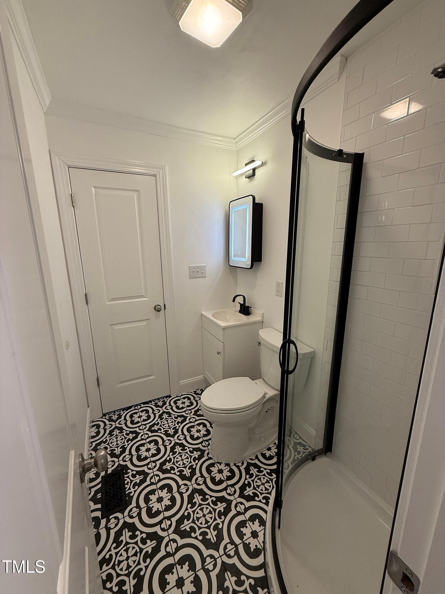 215 Walnut Street Cary, NC 27511 - Photo 15 of 33 a bathroom with a toilet and a shower