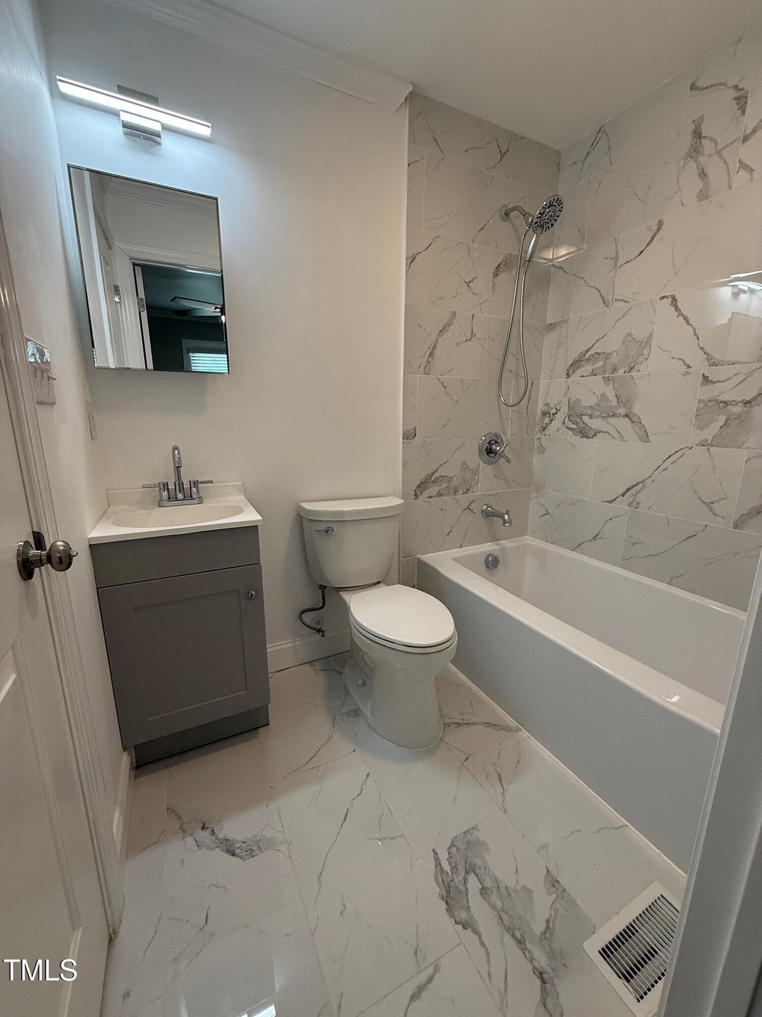 215 Walnut Street Cary, NC 27511 - Photo 16 of 33 a bathroom with a sink toilet and shower