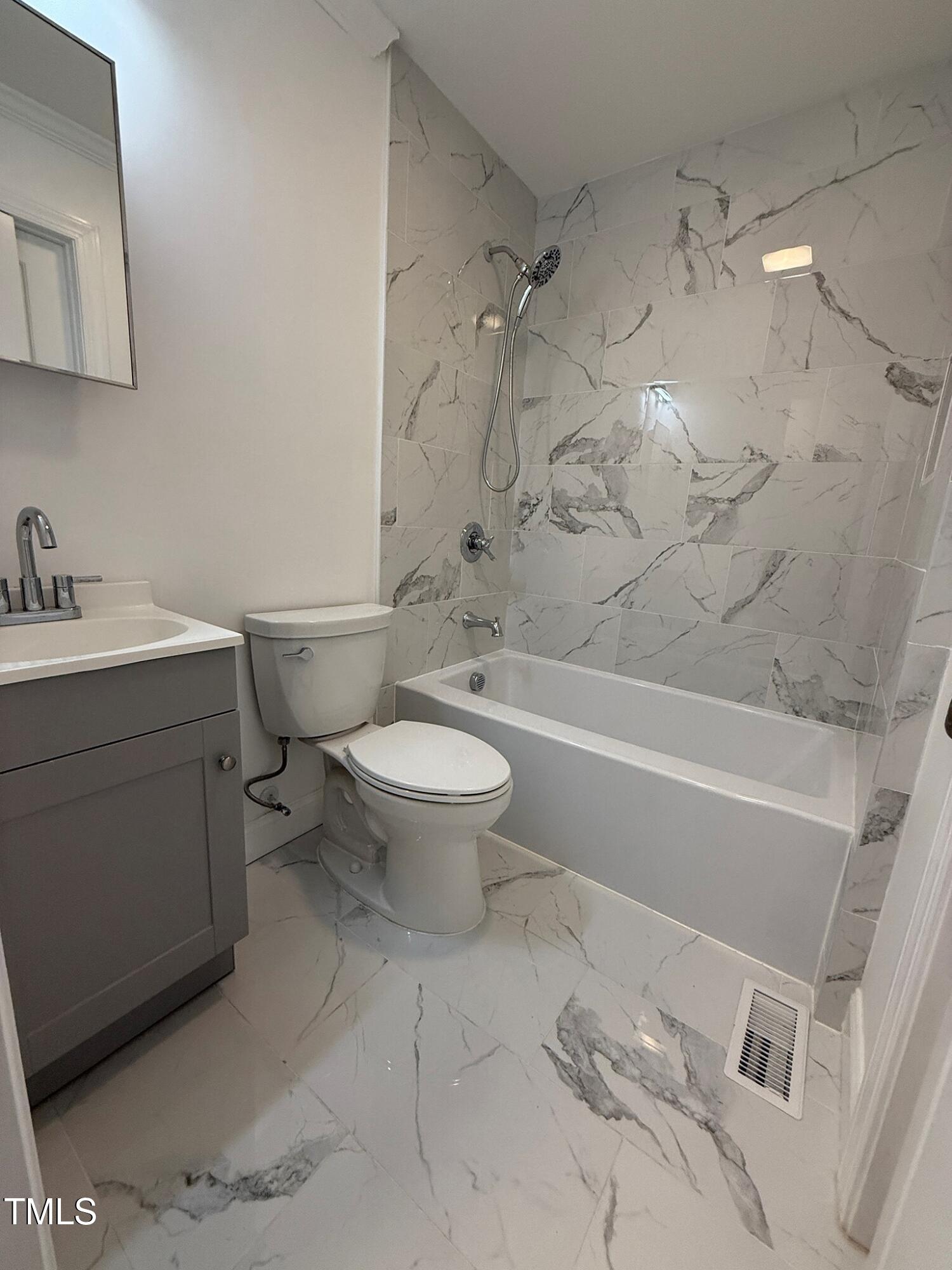 215 Walnut Street Cary, NC 27511 - Photo 17 of 33 a bathroom with a sink toilet and shower