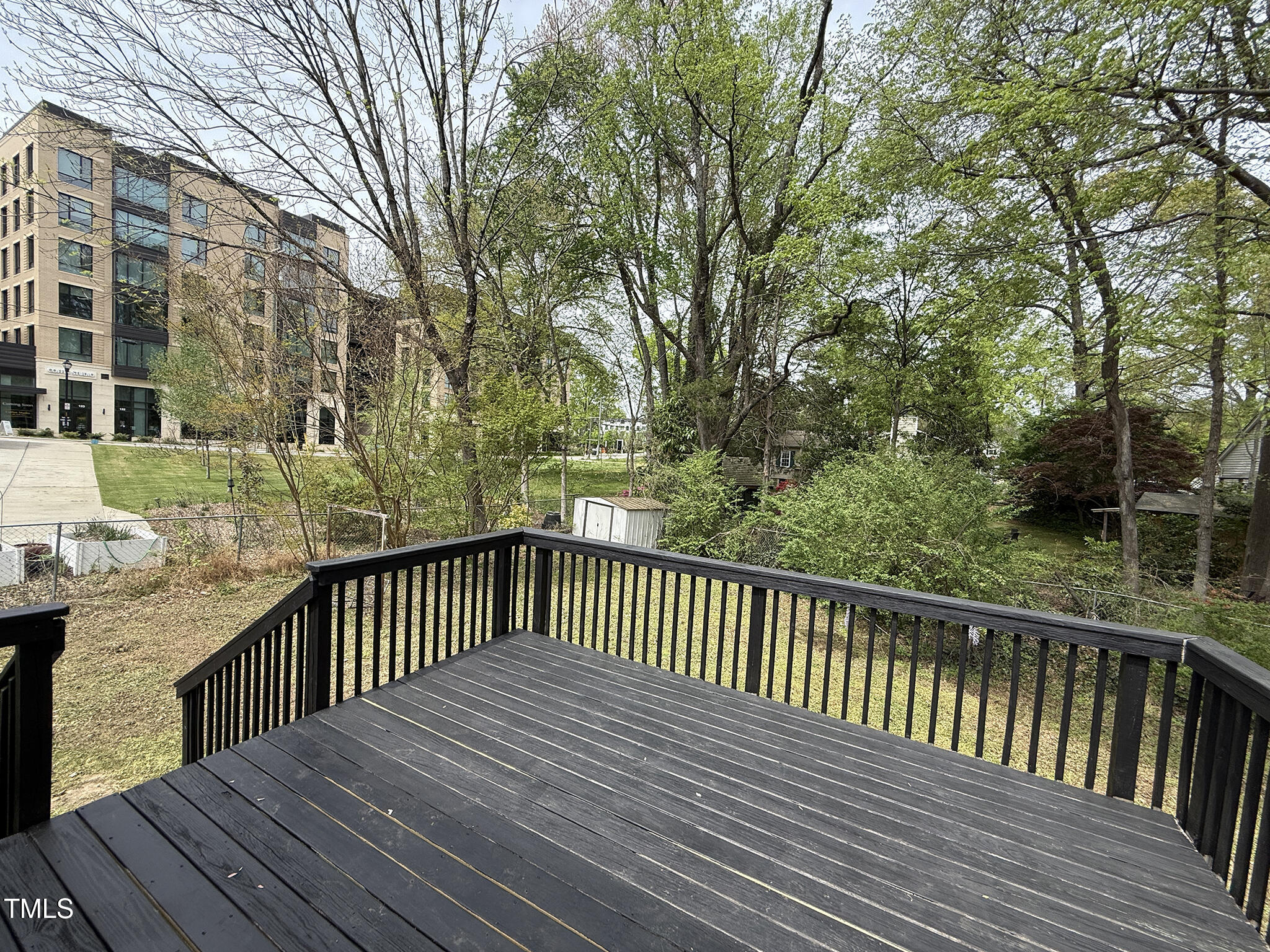 215 Walnut Street Cary, NC 27511 - Photo 22 of 33 a view of deck with wooden floor and fence