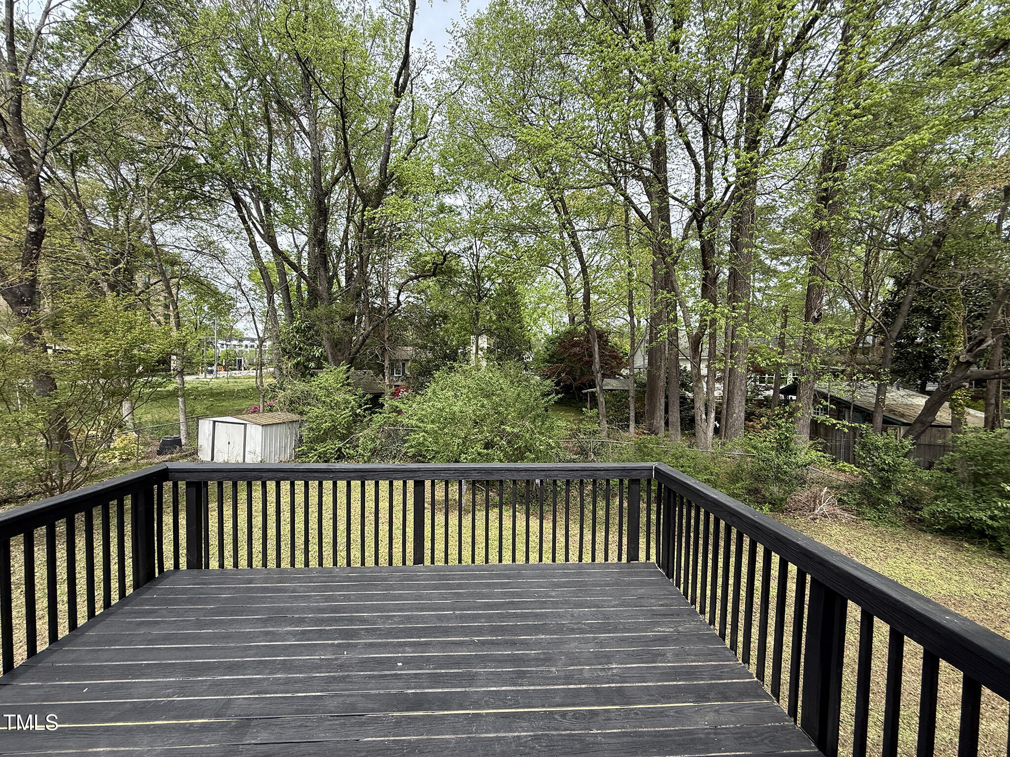 215 Walnut Street Cary, NC 27511 - Photo 23 of 33 a view of a wooden roof deck
