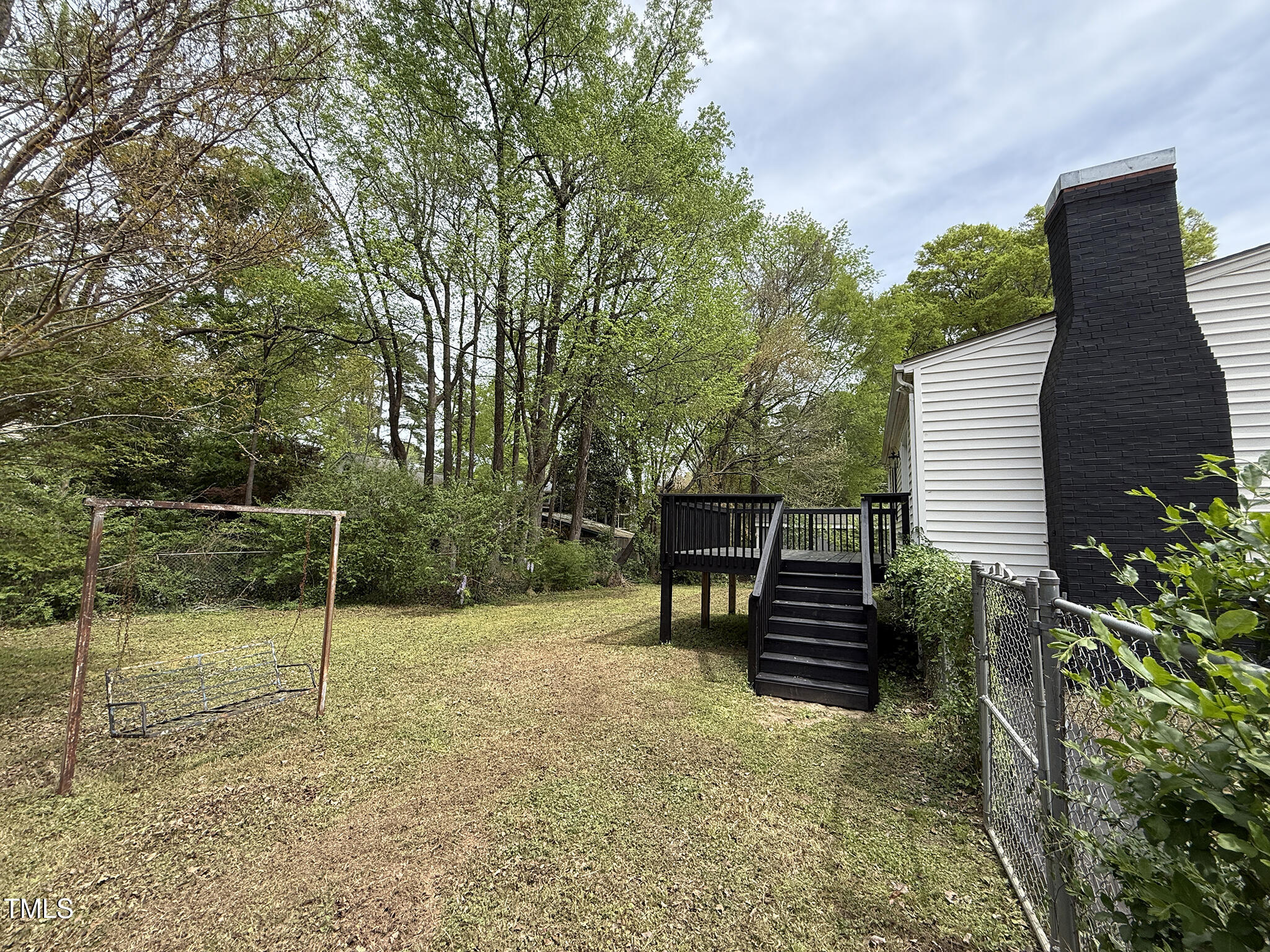 215 Walnut Street Cary, NC 27511 - Photo 26 of 33 a view of a bench in the backyard