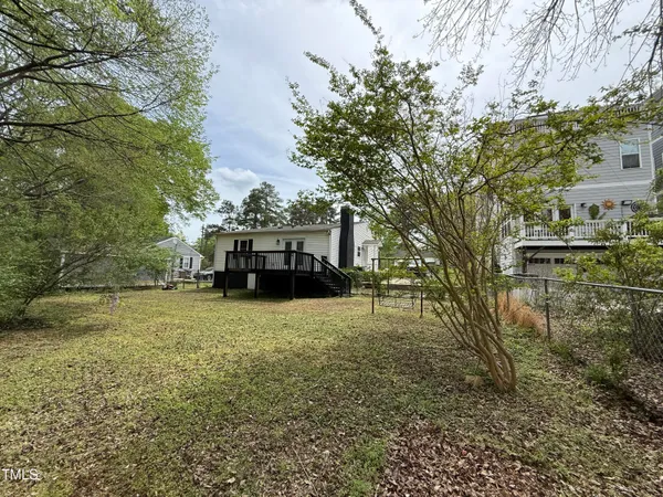 a backyard of a house with lots of green space