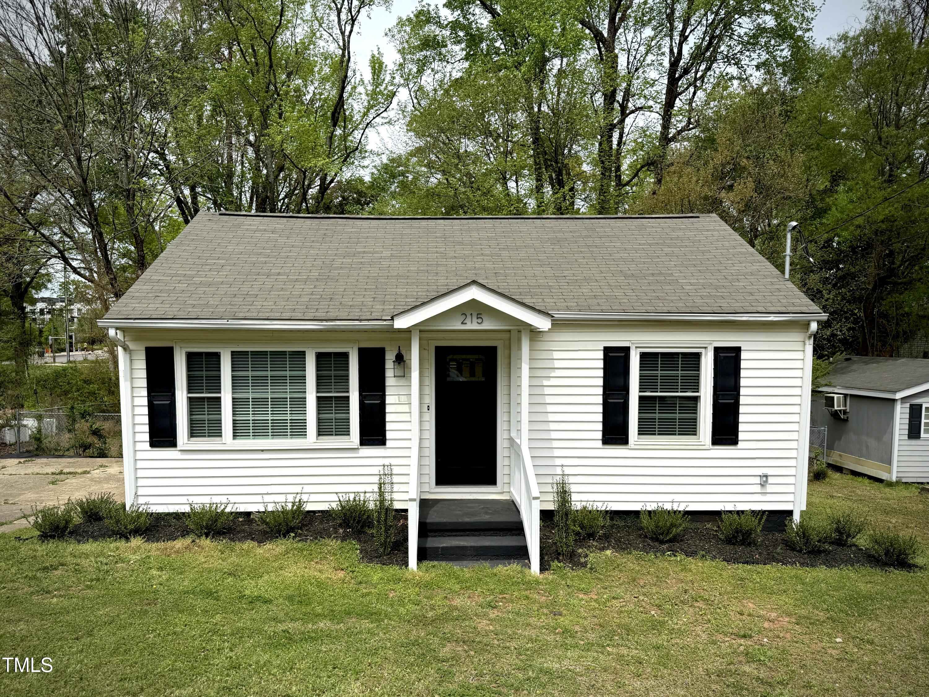 215 Walnut Street Cary, NC 27511 - Photo 31 of 33 a view of a house with a yard and plants