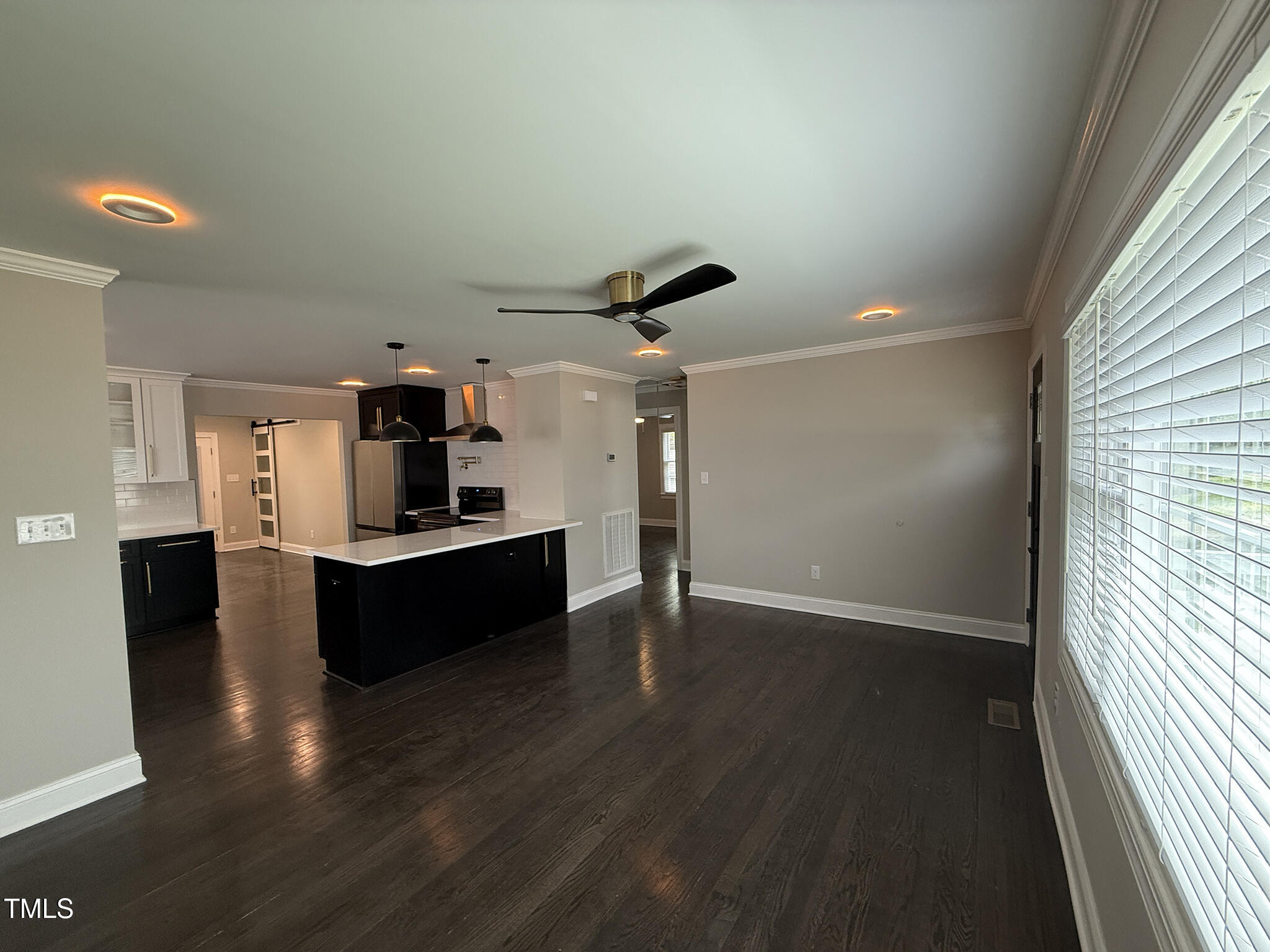 215 Walnut Street Cary, NC 27511 - Photo 4 of 33 a living room with hard wood floors and a window