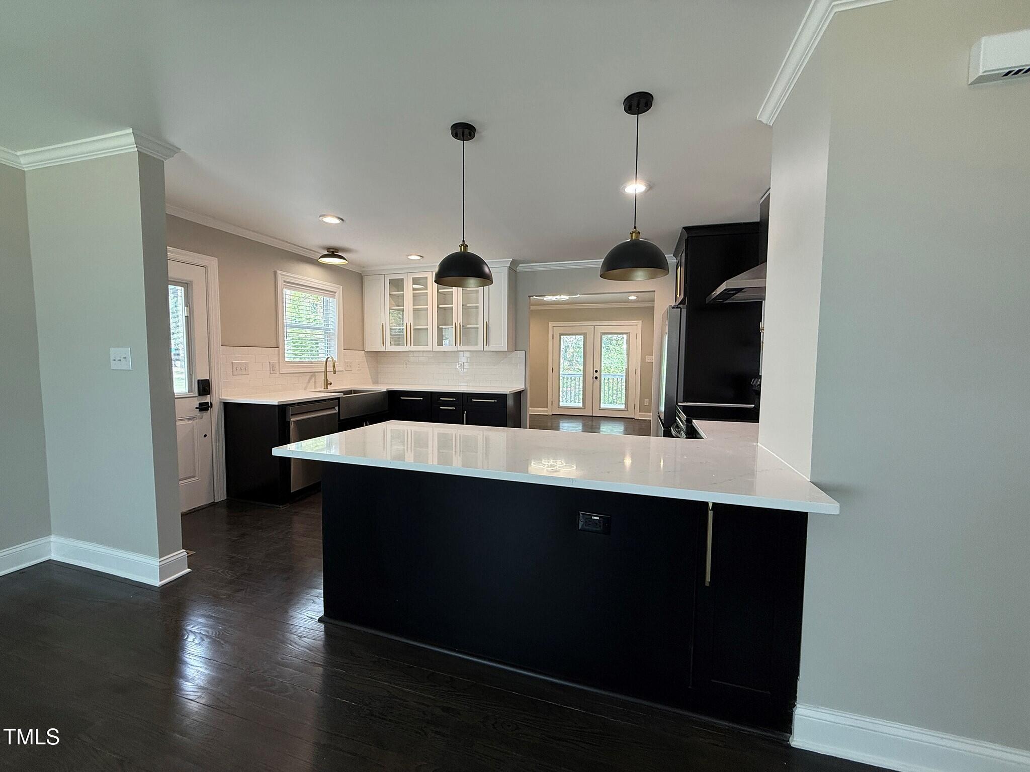 215 Walnut Street Cary, NC 27511 - Photo 6 of 33 a kitchen with a sink a stove and cabinets