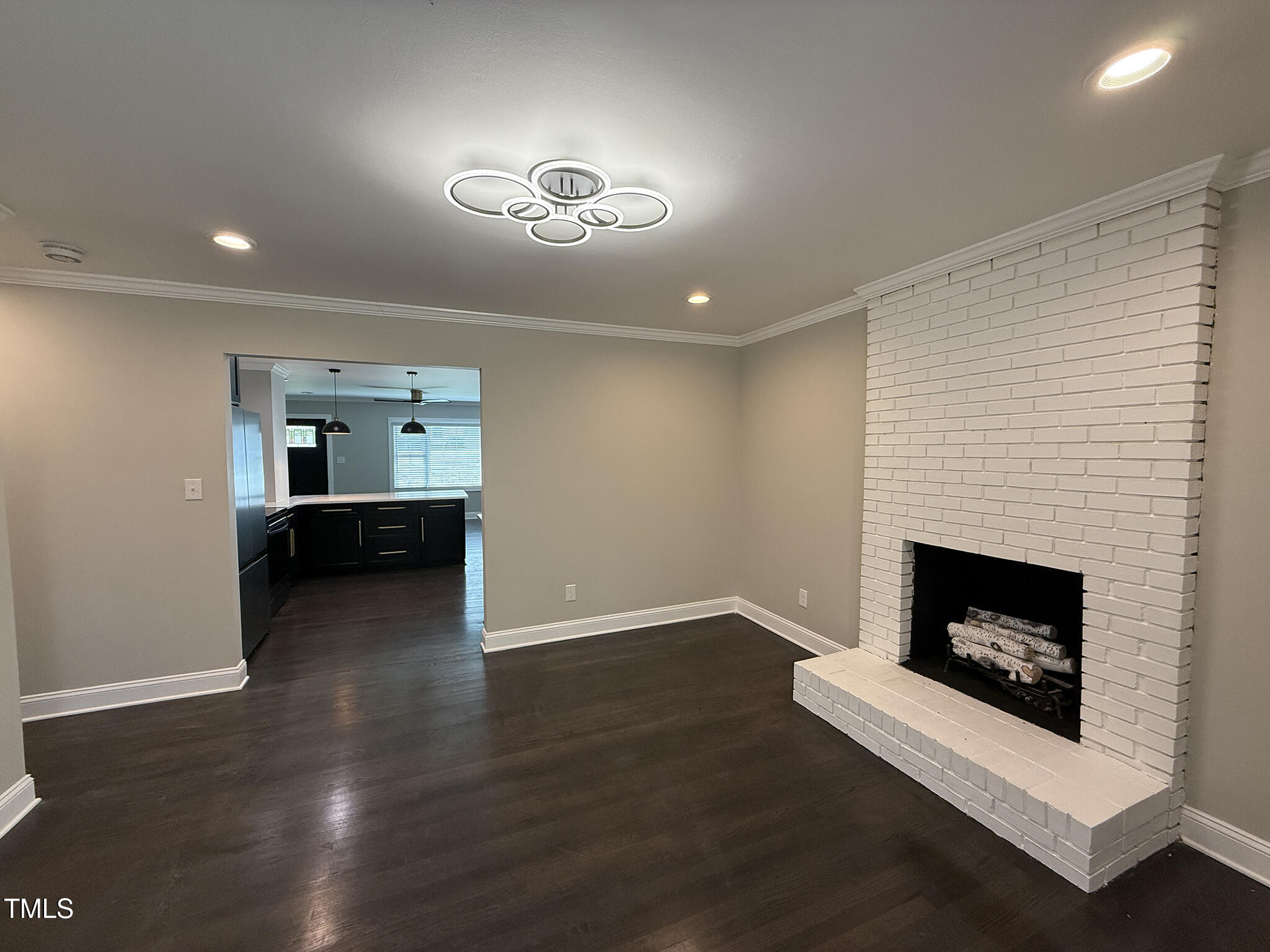 215 Walnut Street Cary, NC 27511 - Photo 10 of 33 a view of a livingroom with a fireplace