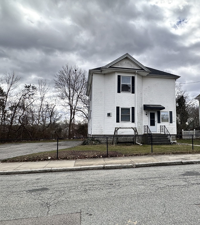 601 Anthony Street Fall River, MA 02721 - Photo 1 of 6 a front view of a house with a yard