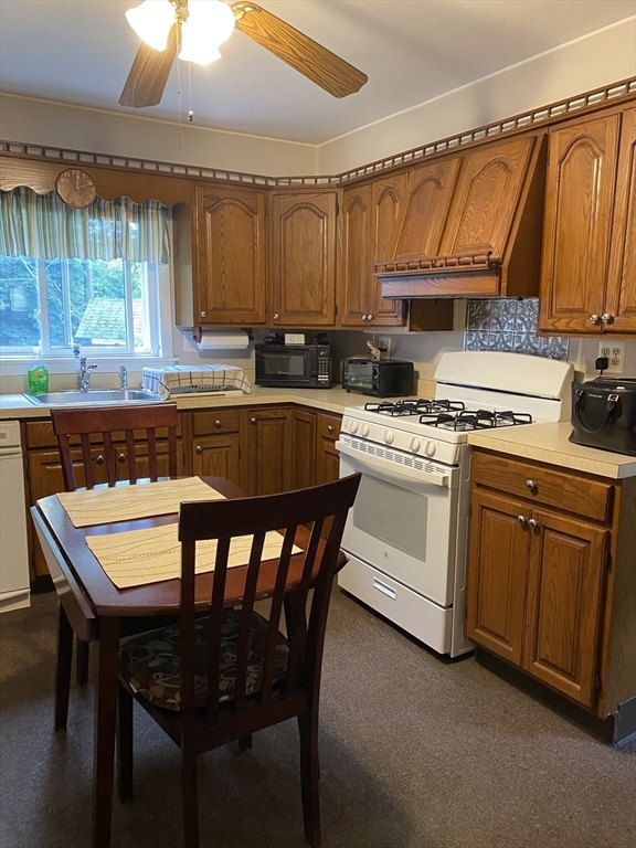 601 Anthony Street Fall River, MA 02721 - Photo 4 of 6 a kitchen that has a cabinets counter space and a stove