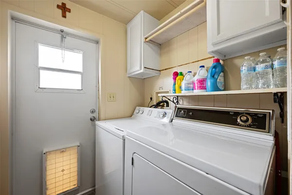 a utility room with dryer and washer